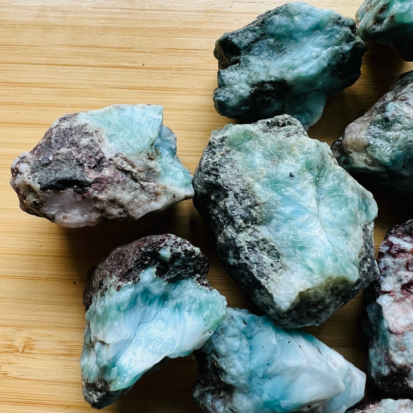 Close-up of Larimar raw stone from Dominican Republic, soothing wellness stone for Emotional Healing