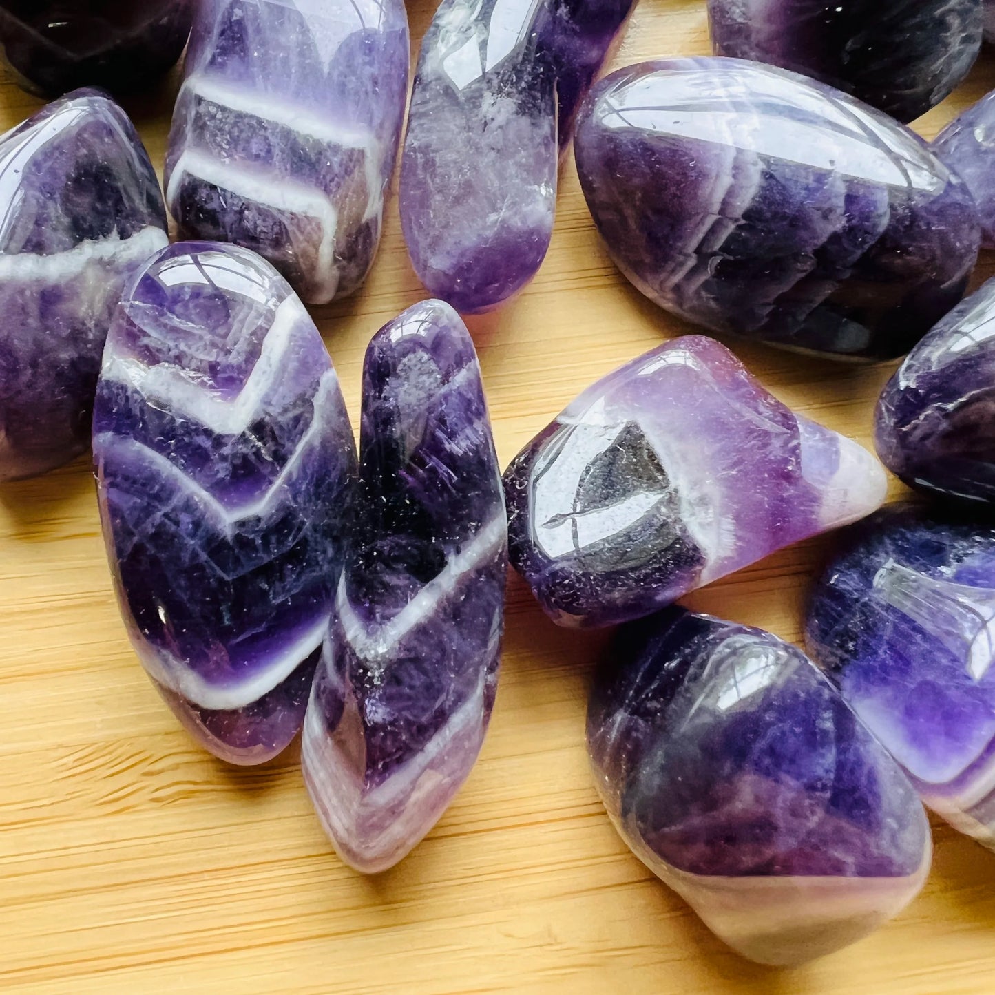 Surface detail of Grade AA purple Chevron Amethyst tumbled stone, kept near for Intuition and Meditation, from Copperbelt.