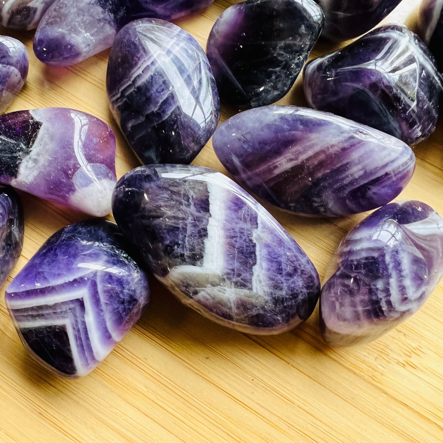 Underside view of Chevron Amethyst tumbled stone, sourced from Copperbelt Province, Zambia.
