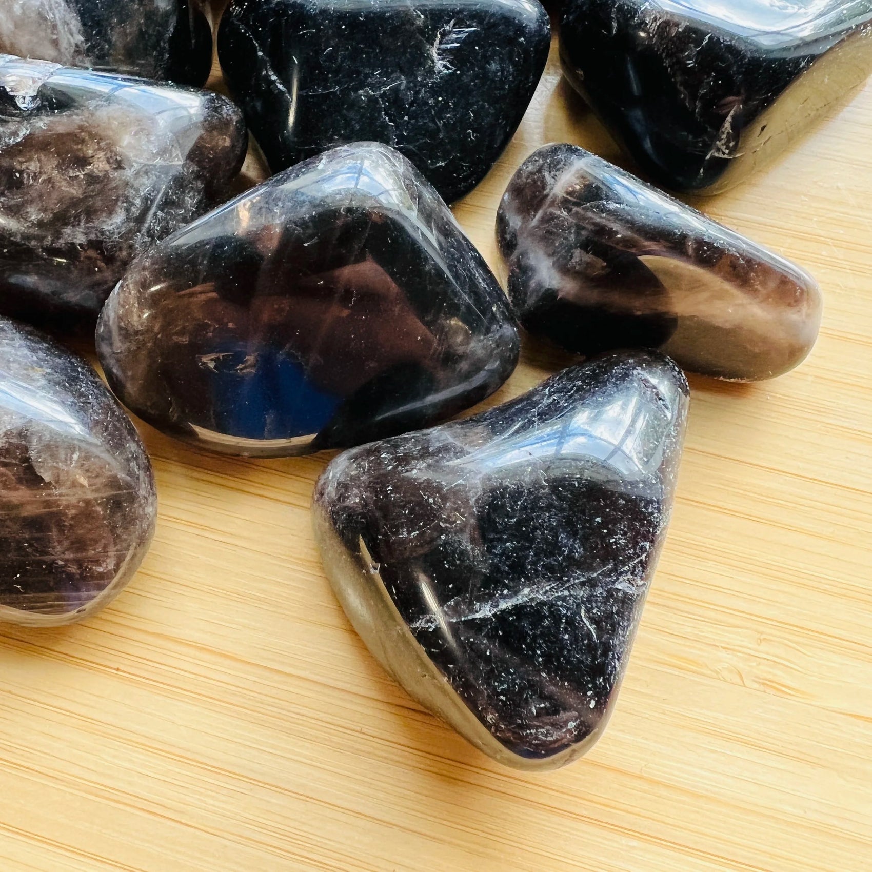 Detail capture of Smoky Quartz tumbled stone, traditionally used for Grounding, Madagascar-sourced.