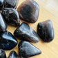 Reverse side of Smoky Quartz tumbled stone, sourced from Madagascar, showing natural texture.