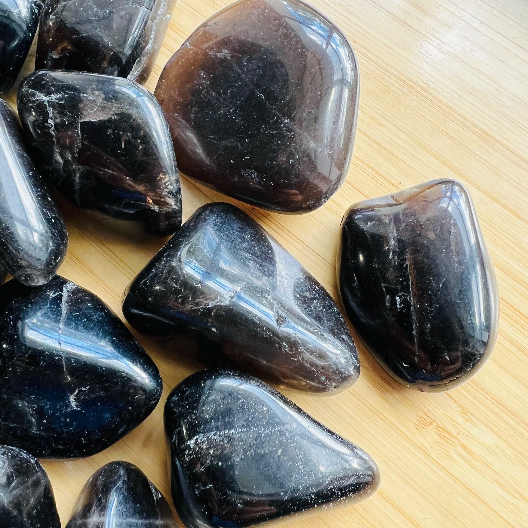 Reverse side of Smoky Quartz tumbled stone, sourced from Madagascar, showing natural texture.