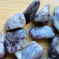 Back view of Pink Tourmaline tumbled stone, sourced from Vakinankaratra, Madagascar, showing soft luster.