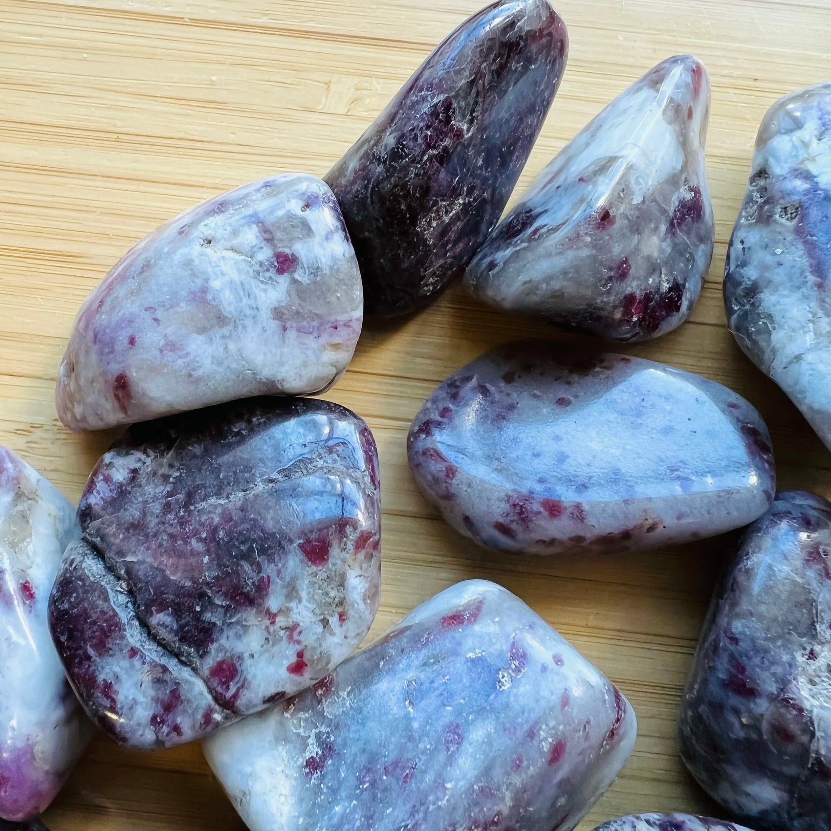 Back view of Pink Tourmaline tumbled stone, sourced from Vakinankaratra, Madagascar, showing soft luster.