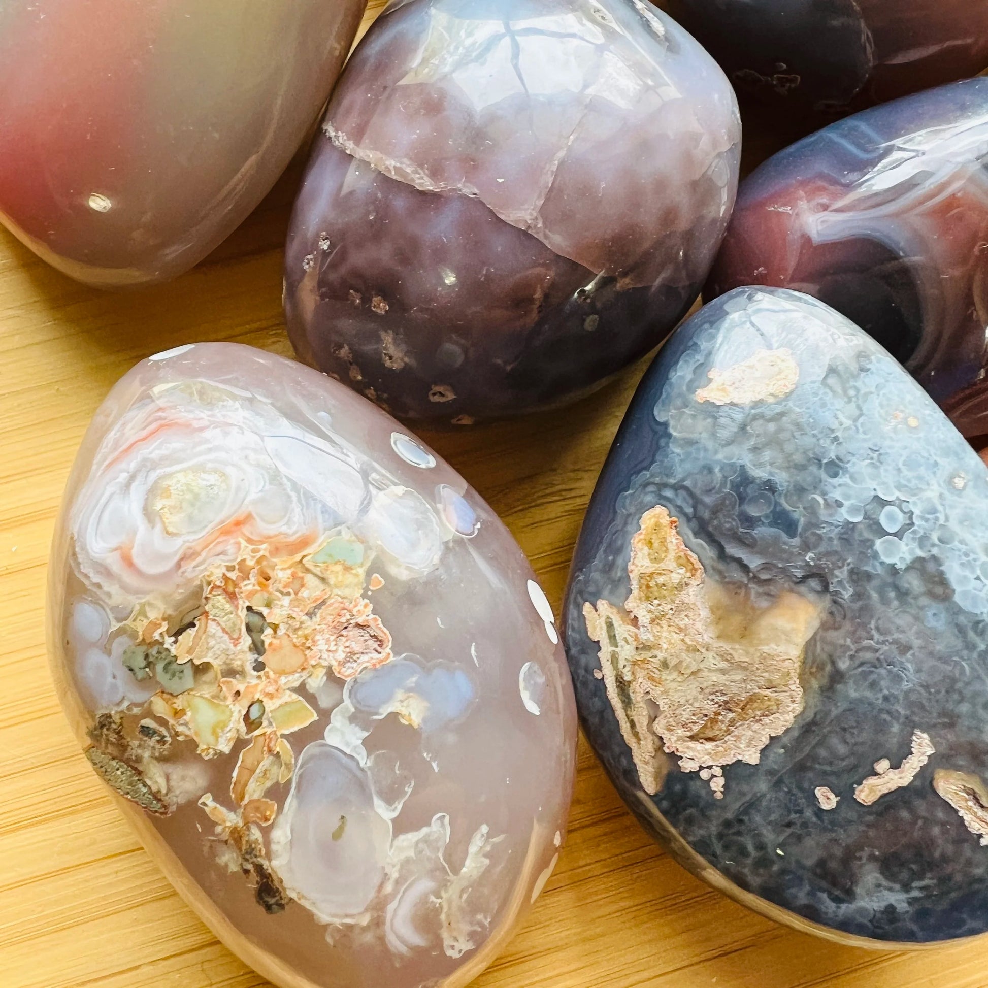 Side profile of Red Agate palm stone, to support Grounding.