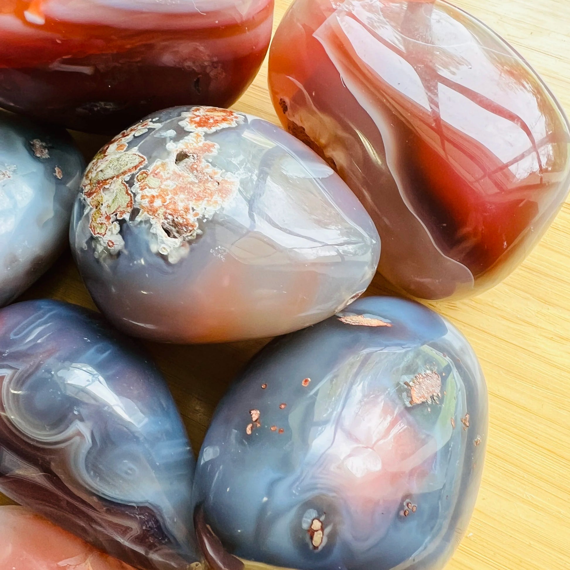 Reverse angle of Grade AA Red Agate palm stone, showing soft luster.