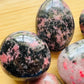 Full profile of Grade AA Rhodonite palm stone ready to ship from Beyond Bohemian