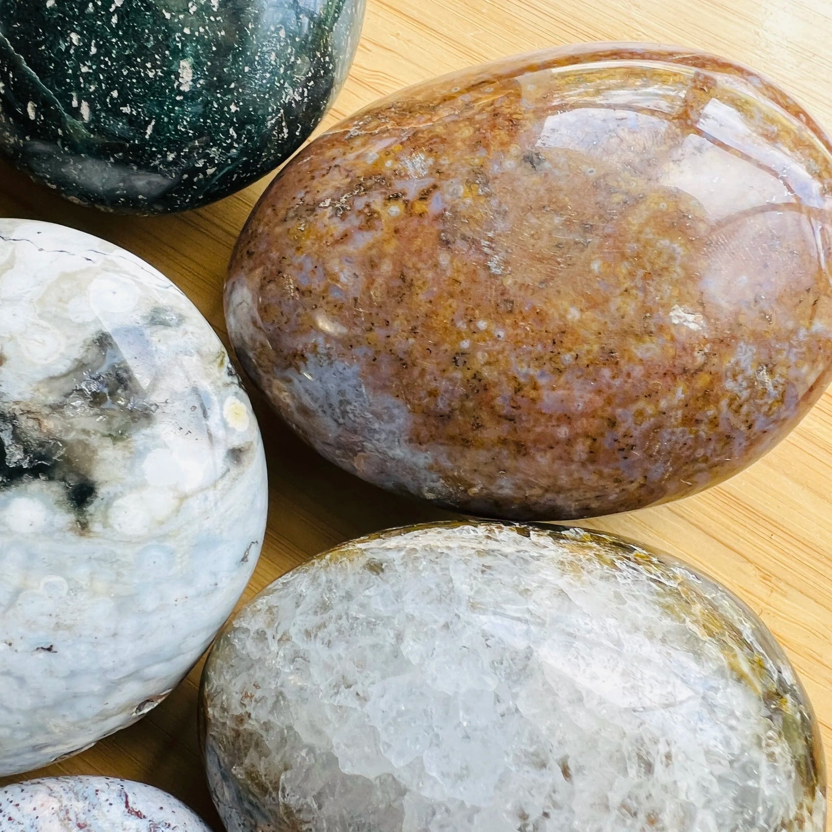Underside detail of Ocean Jasper palm stone, showing matte finish.