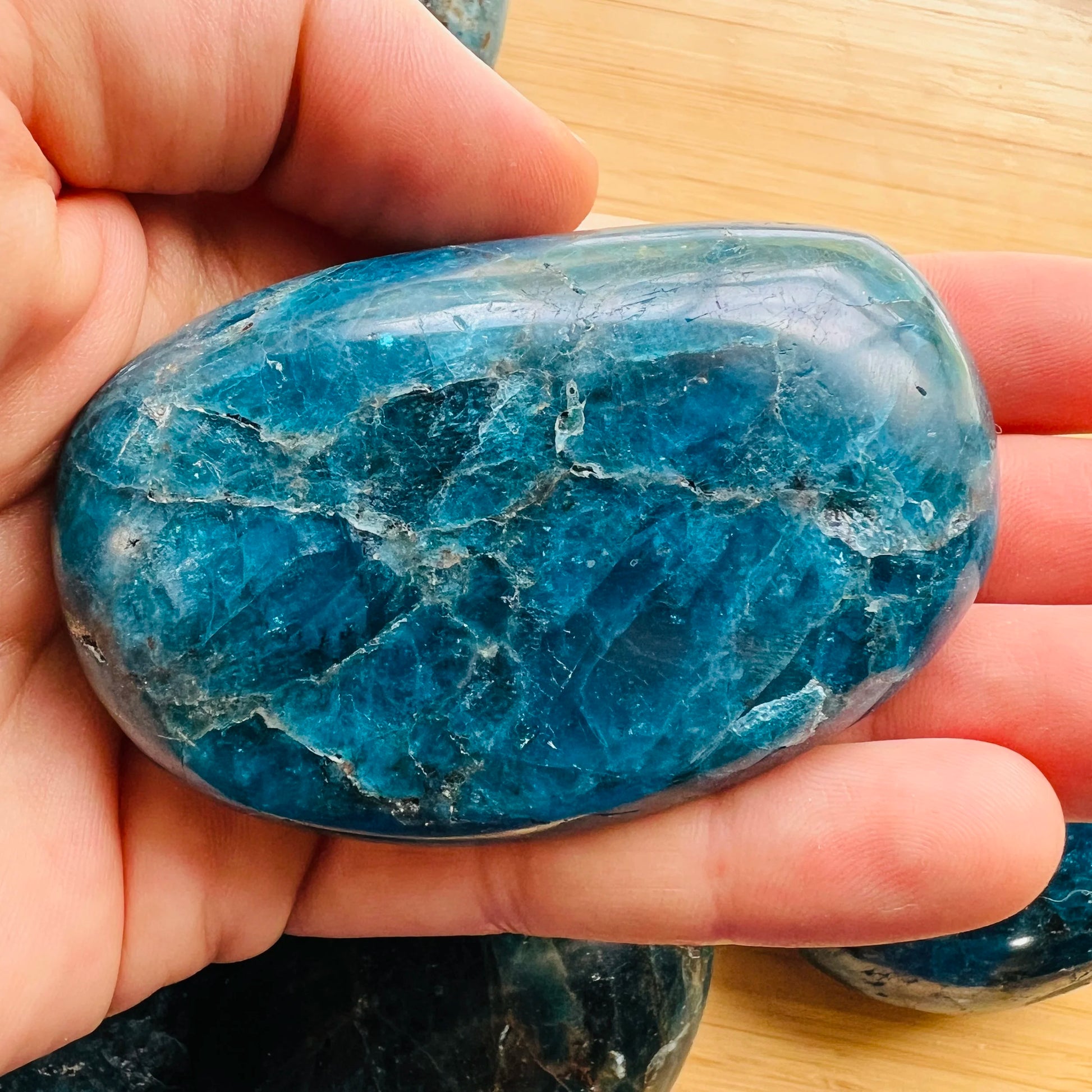Back view of Grade AA Apatite palm stone showing natural surface