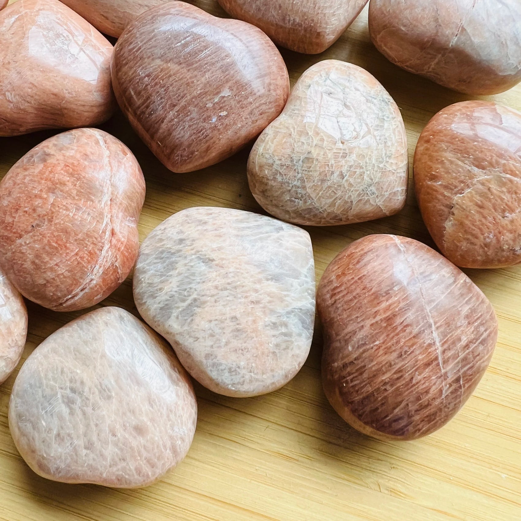 Top view of Peach Moonstone polished heart, from Alaotra-Mangoro, Madagascar, showing translucent edges.