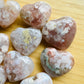 Reverse angle of Flower Agate polished heart, linked to Love and Emotional Healing, showing characteristic color.