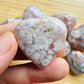 Back view of Grade AA Flower Agate heart showing natural surface