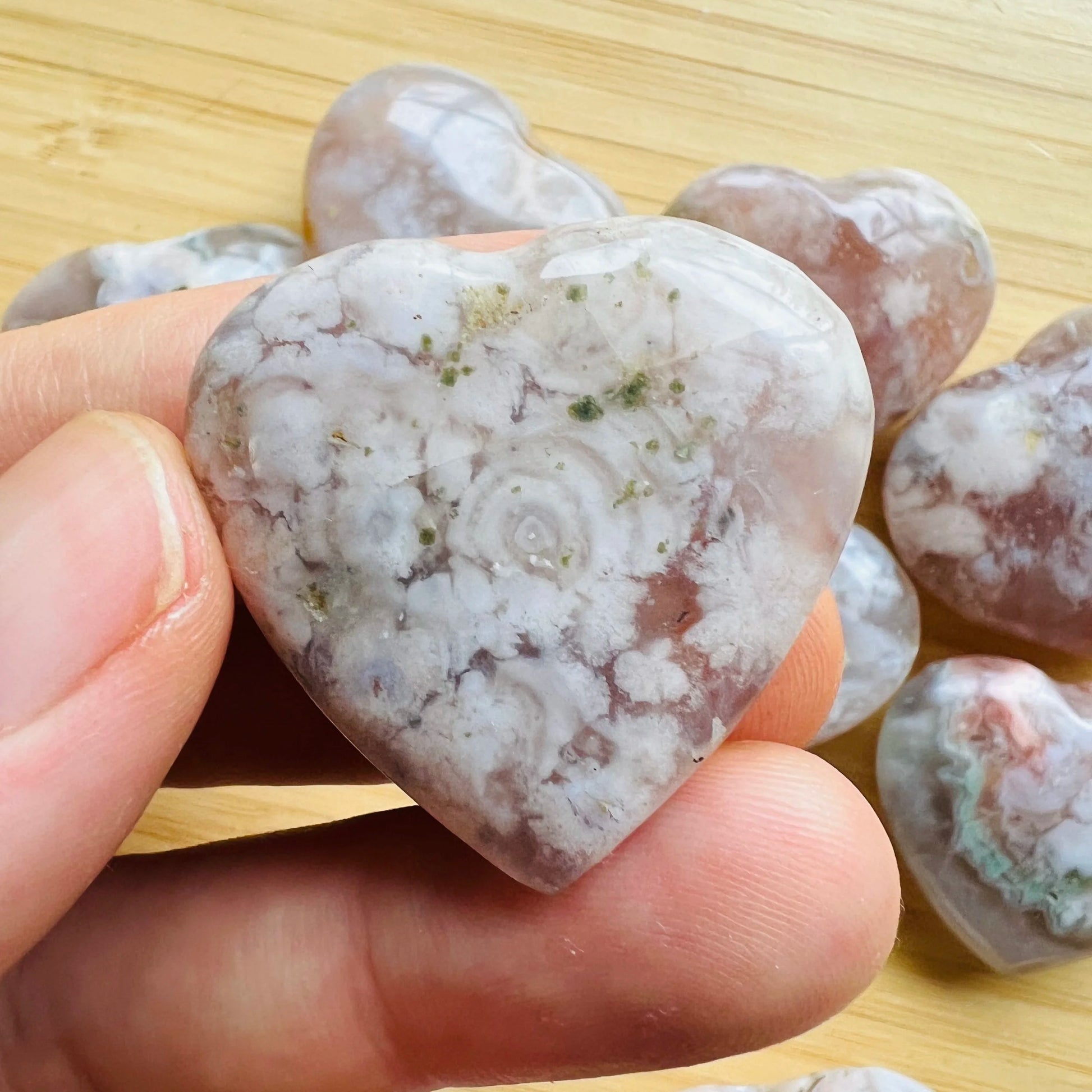 Back view of Grade AA Flower Agate heart showing natural surface