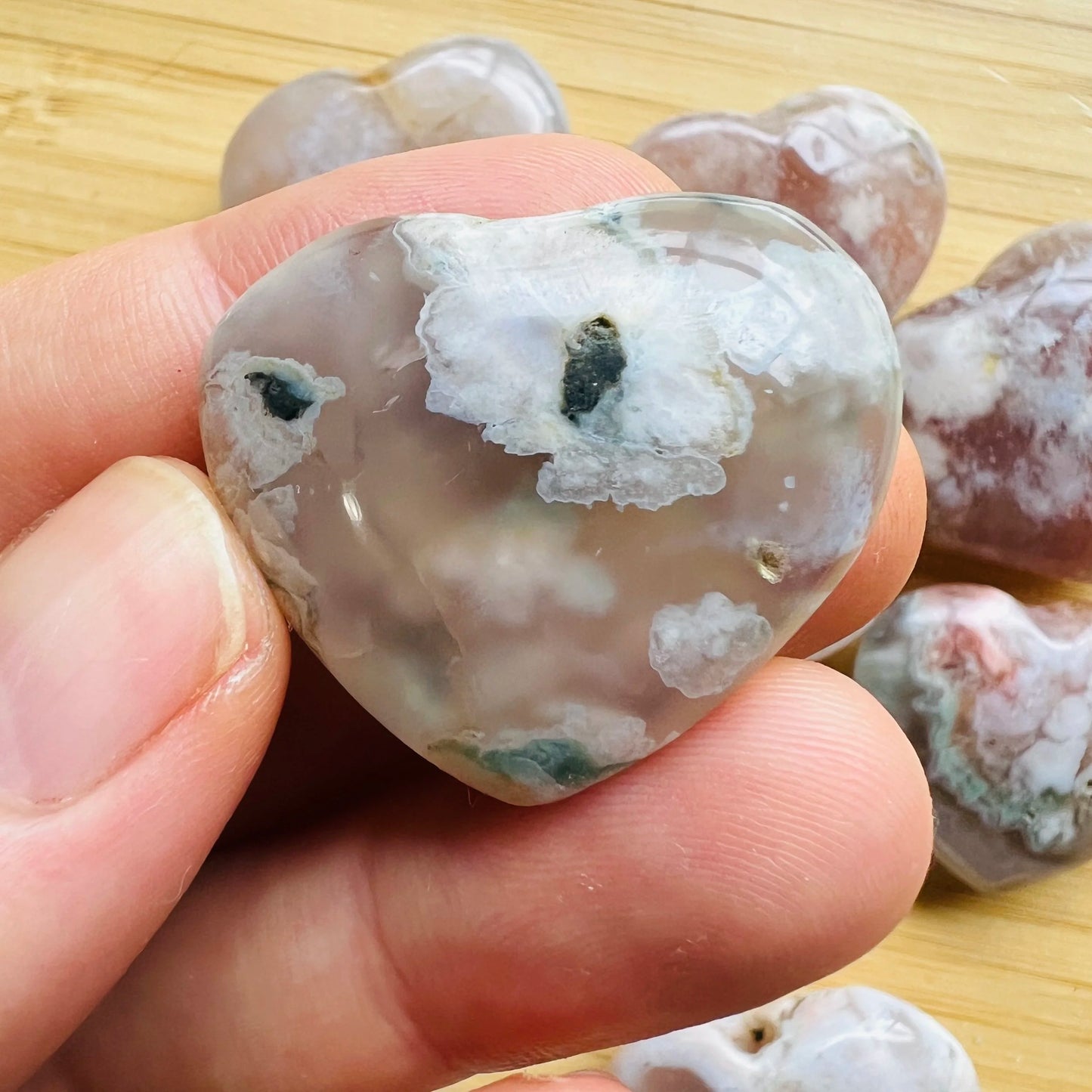 Detail shot of Grade AA Flower Agate heart under natural light