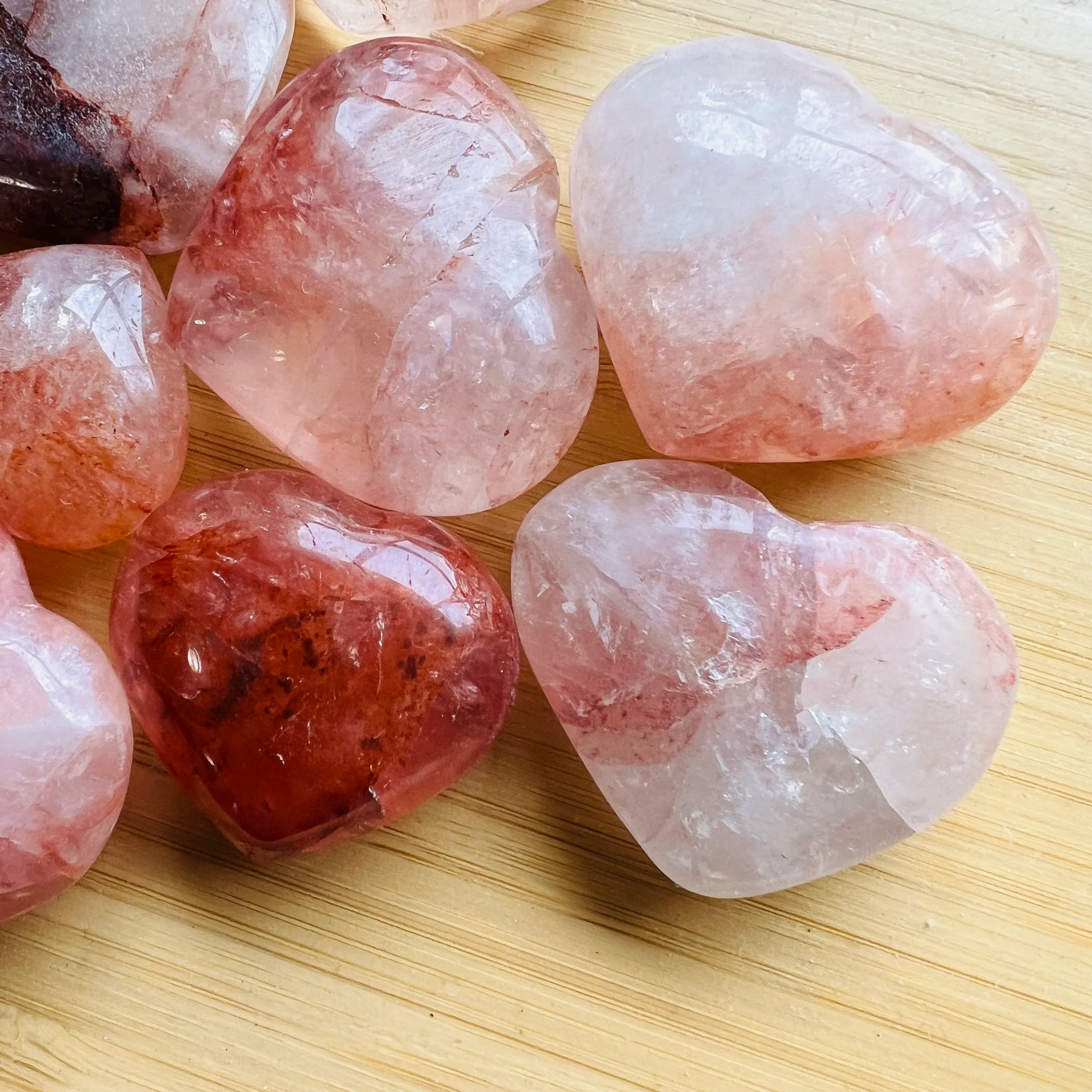 Aerial view of Fire Quartz polished heart, showing natural inclusions, Madagascar-sourced.