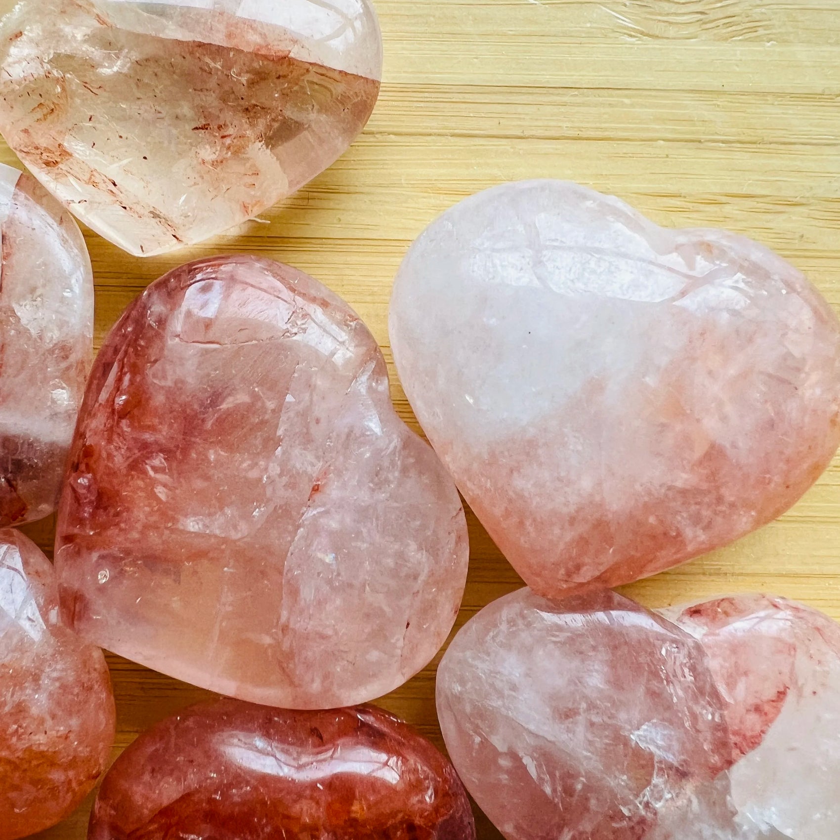 In-hand view of a Fire Quartz polished heart, from Madagascar.