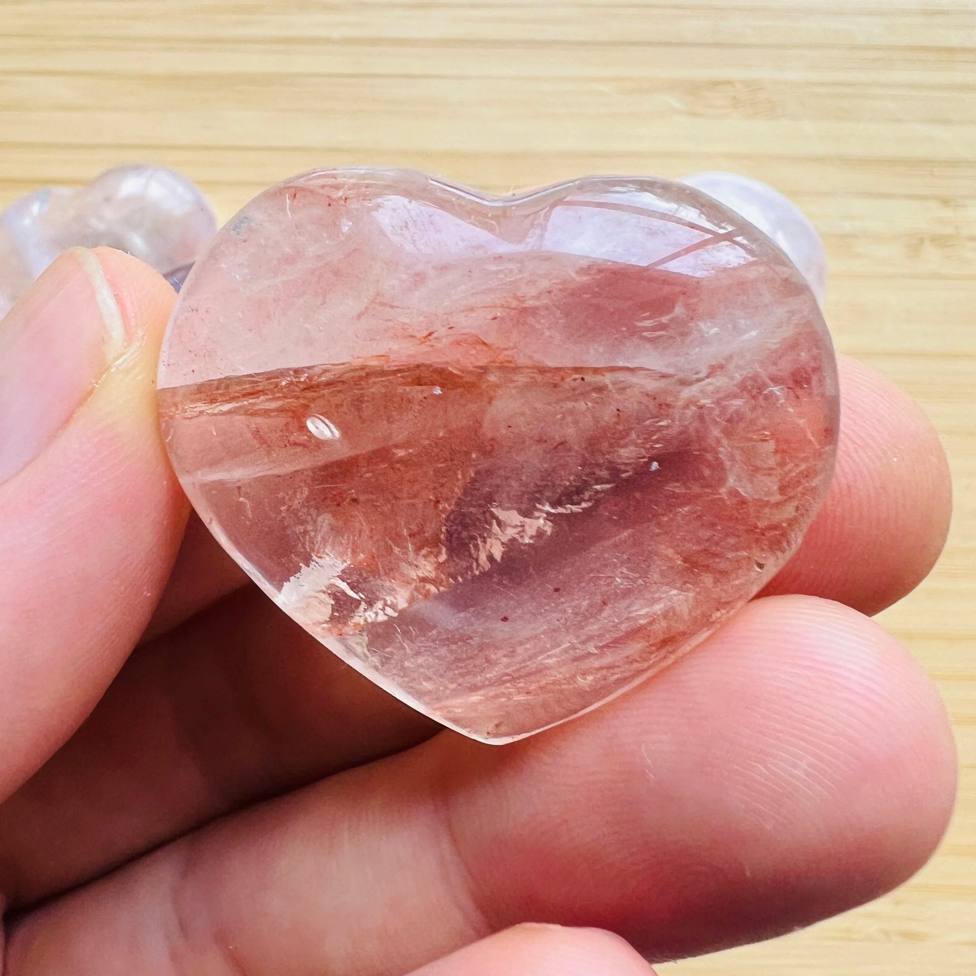 Detail shot of Grade AA Fire Quartz heart under natural light