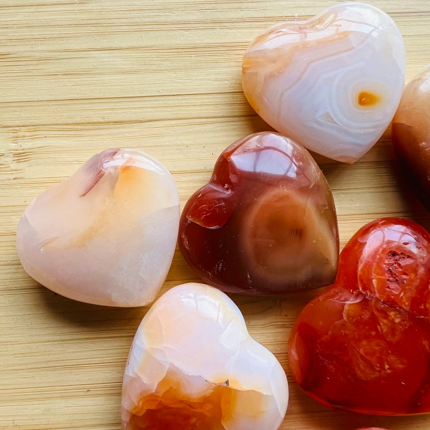 Grade aa carnelian heart held in hand for size reference