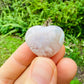 Edge view of Flower Agate polished heart, from Madagascar, carried for Love and Emotional Healing.