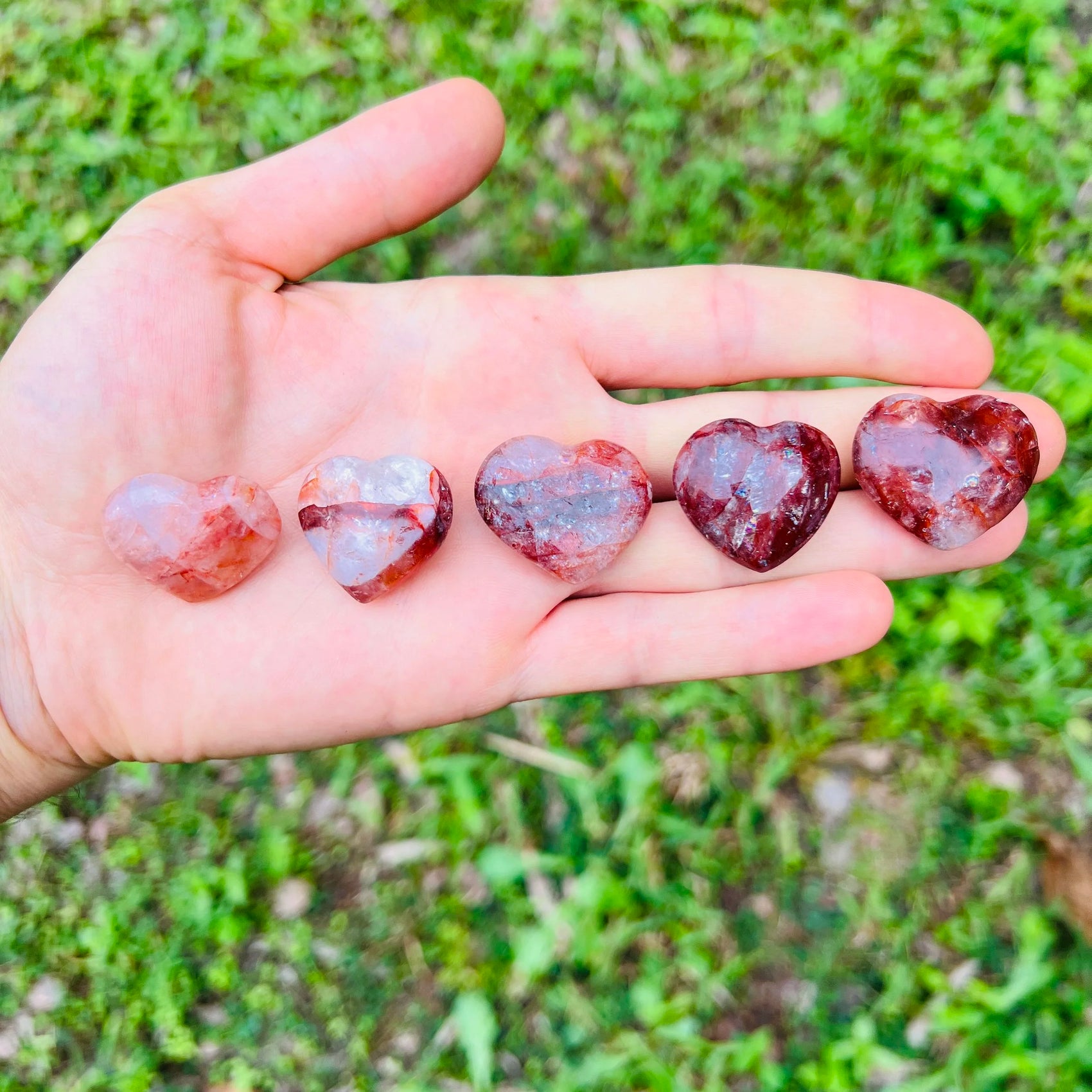 Close detail of Fire Quartz polished heart, showing soft luster.