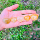 Color detail of yellow Golden Healer polished heart, showing natural variation, from Madagascar.