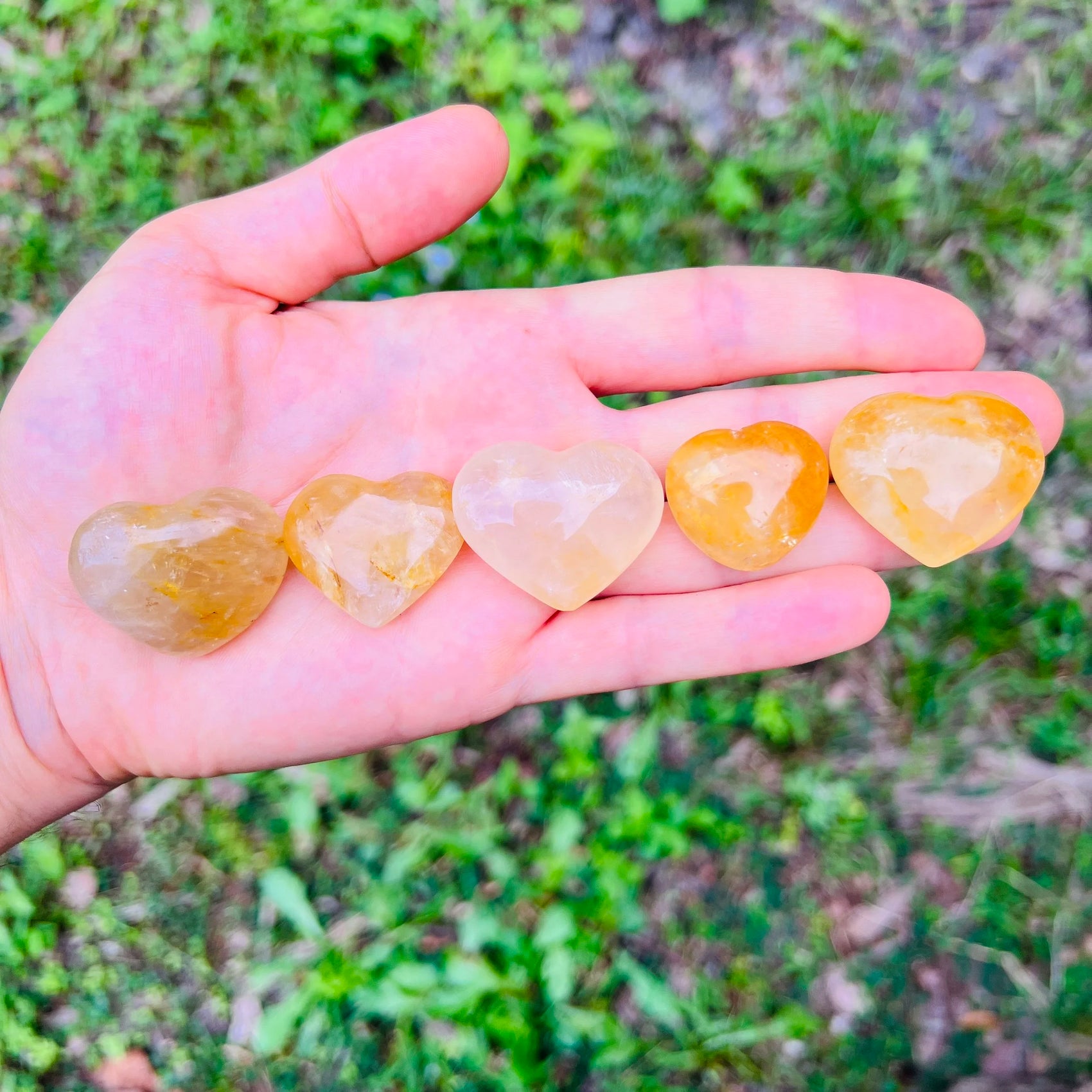 Color detail of yellow Golden Healer polished heart, showing natural variation, from Madagascar.