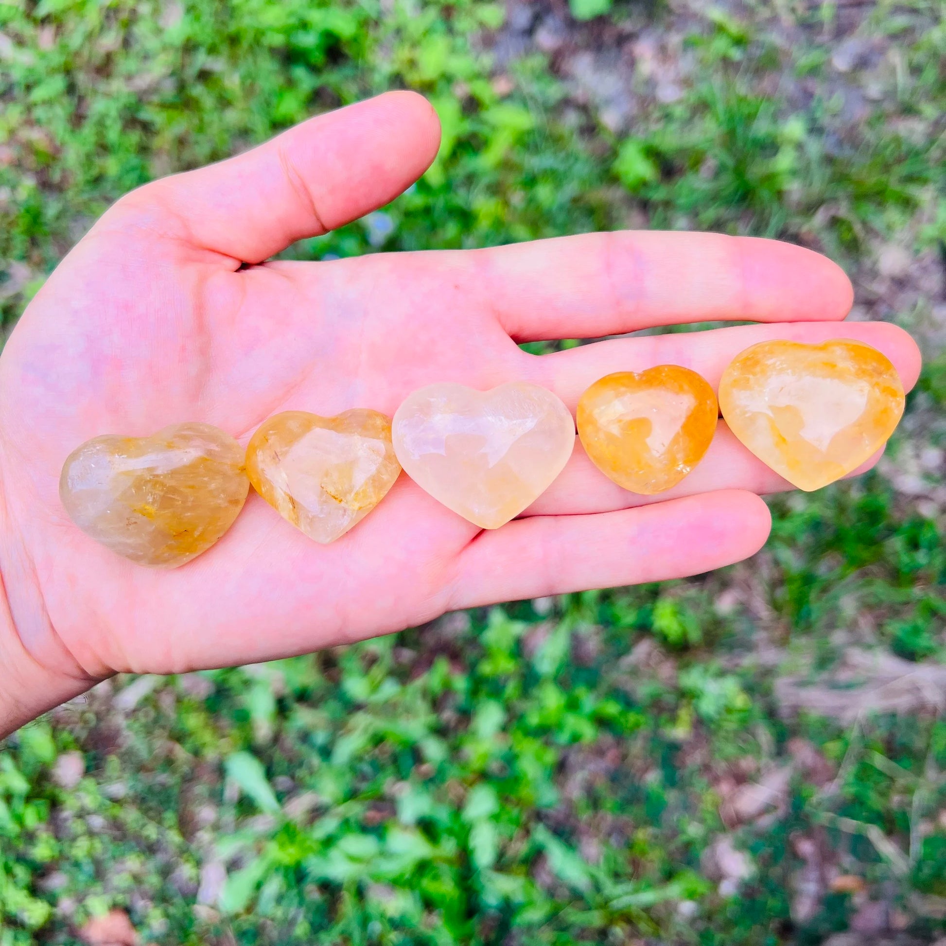 Color detail of yellow Golden Healer polished heart, showing natural variation, from Madagascar.