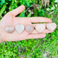 Texture-level view of Grade AA Peach Moonstone polished heart, from Madagascar, showing translucent edges.