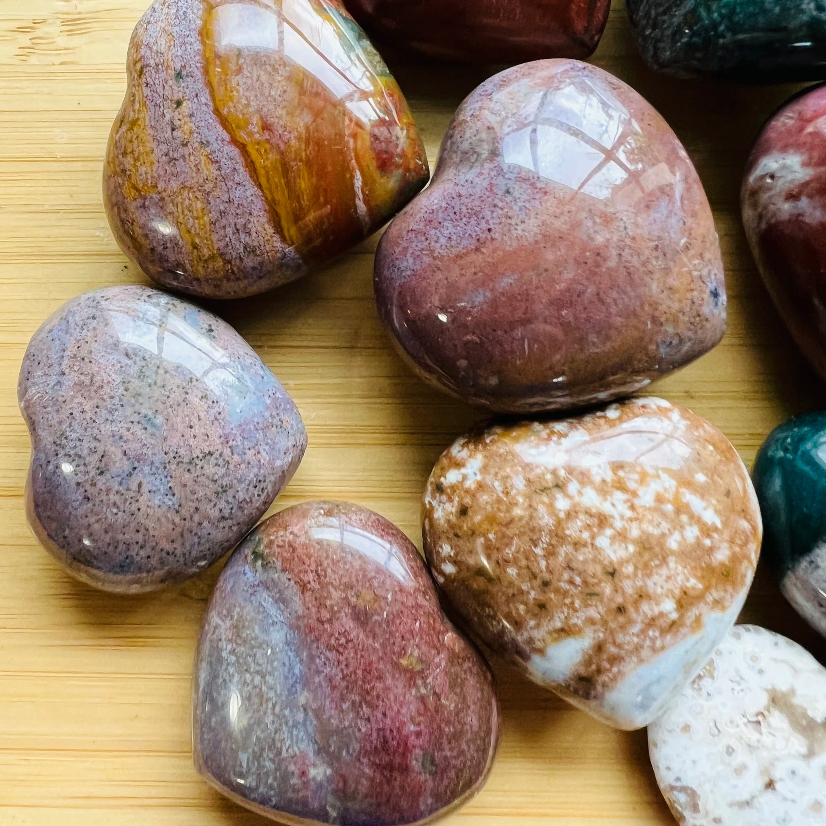 Reverse angle of Ocean Jasper polished heart, sourced from Sofia, Madagascar, showing earthy tone.