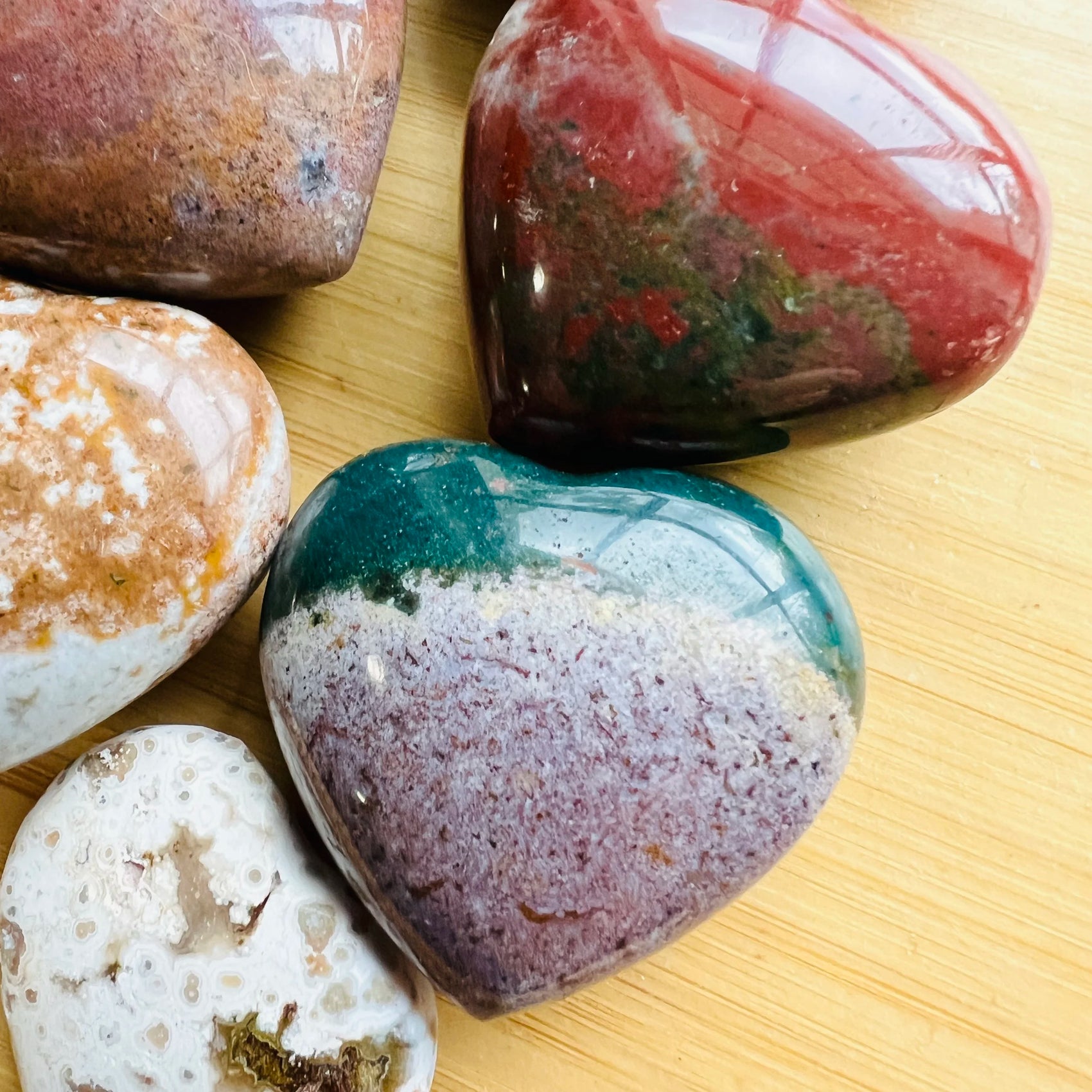 Looking down on Ocean Jasper polished heart, worked with for Emotional Healing and Stress Relief, sourced from Madagascar.