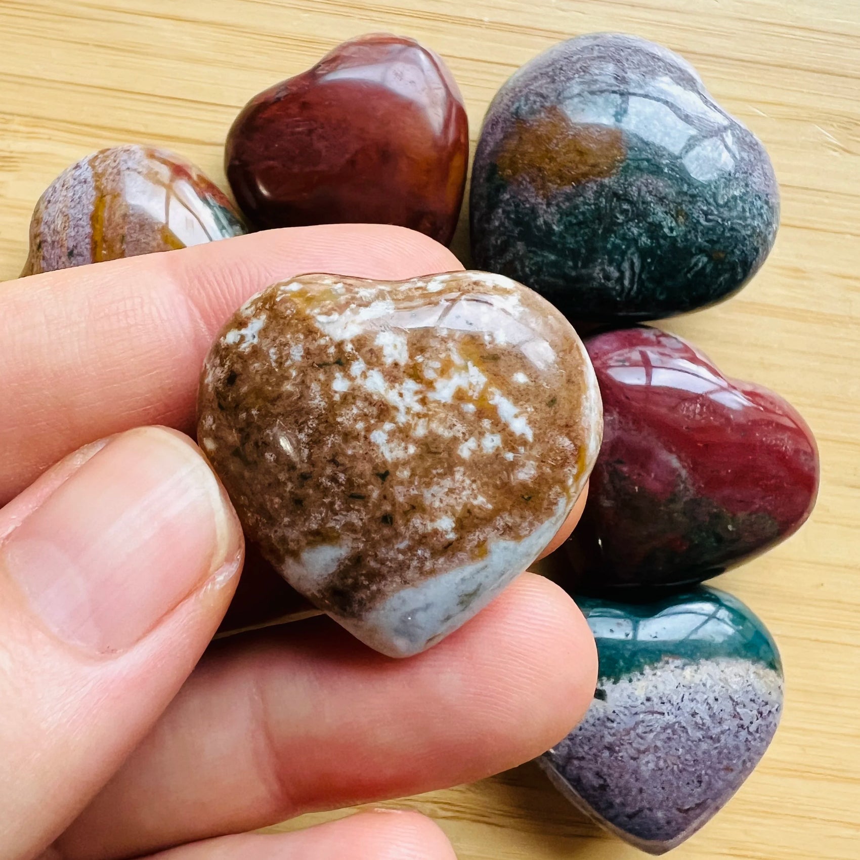 Scale reference of a Ocean Jasper polished heart carried for Emotional Healing, sourced from Sofia, Madagascar.