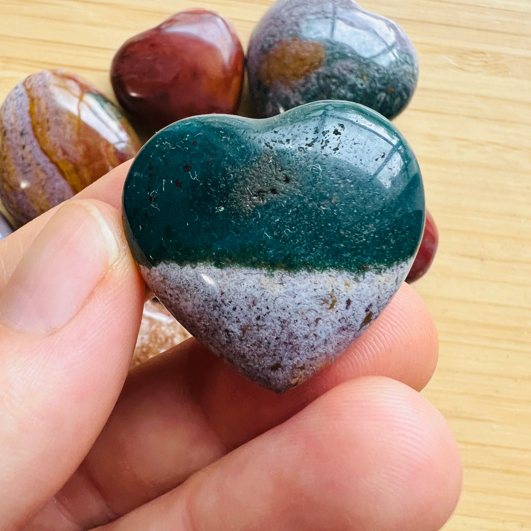 Detail shot of Grade AA Ocean Jasper heart under natural light