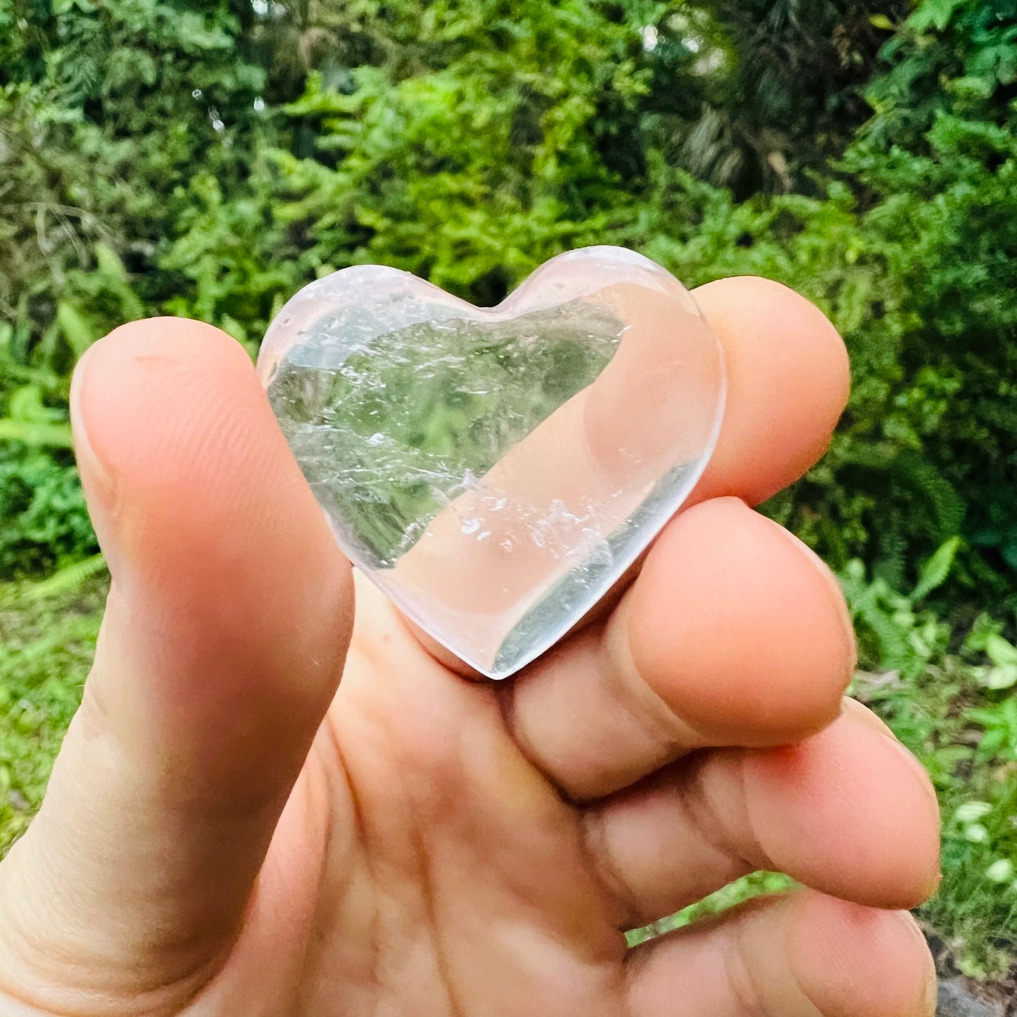 Held in palm of a Clear Quartz stone, from Minas Gerais, Brazil, with character of the piece on display.