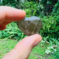 Detail shot showing Smoky Quartz polished heart, sourced from Brazil, traditionally used for Grounding.