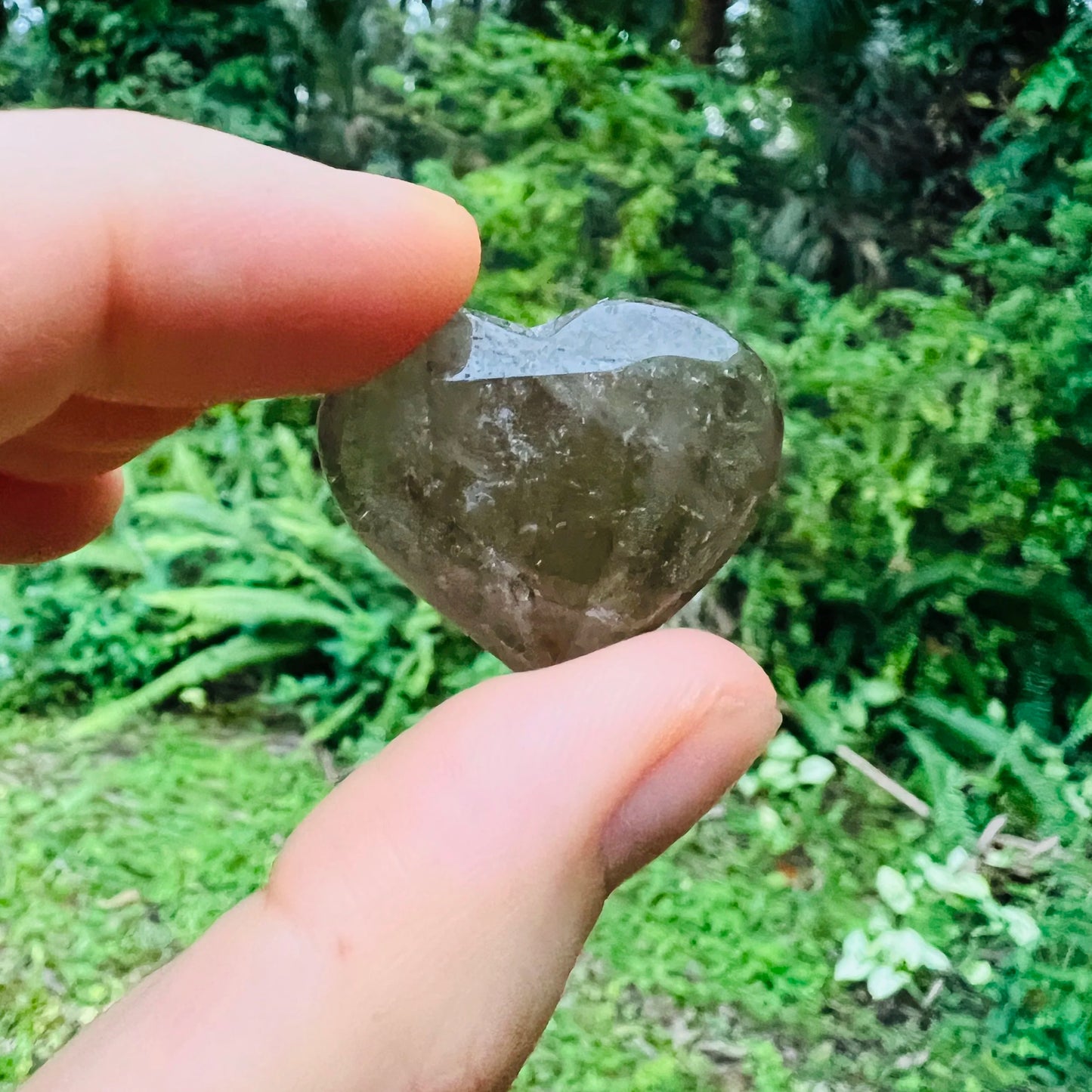 Detail shot showing Smoky Quartz polished heart, sourced from Brazil, traditionally used for Grounding.