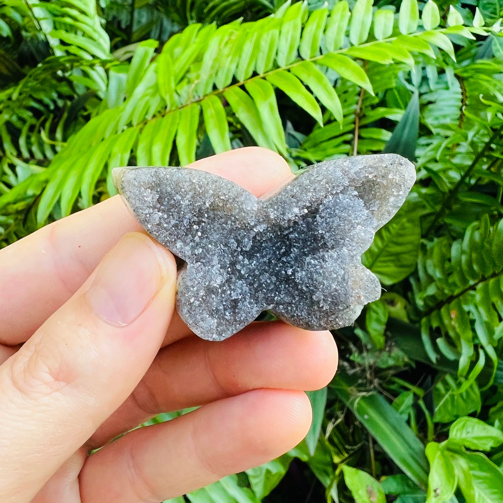 Reverse angle of Grade A Amethyst polished butterfly, showing translucent edges.