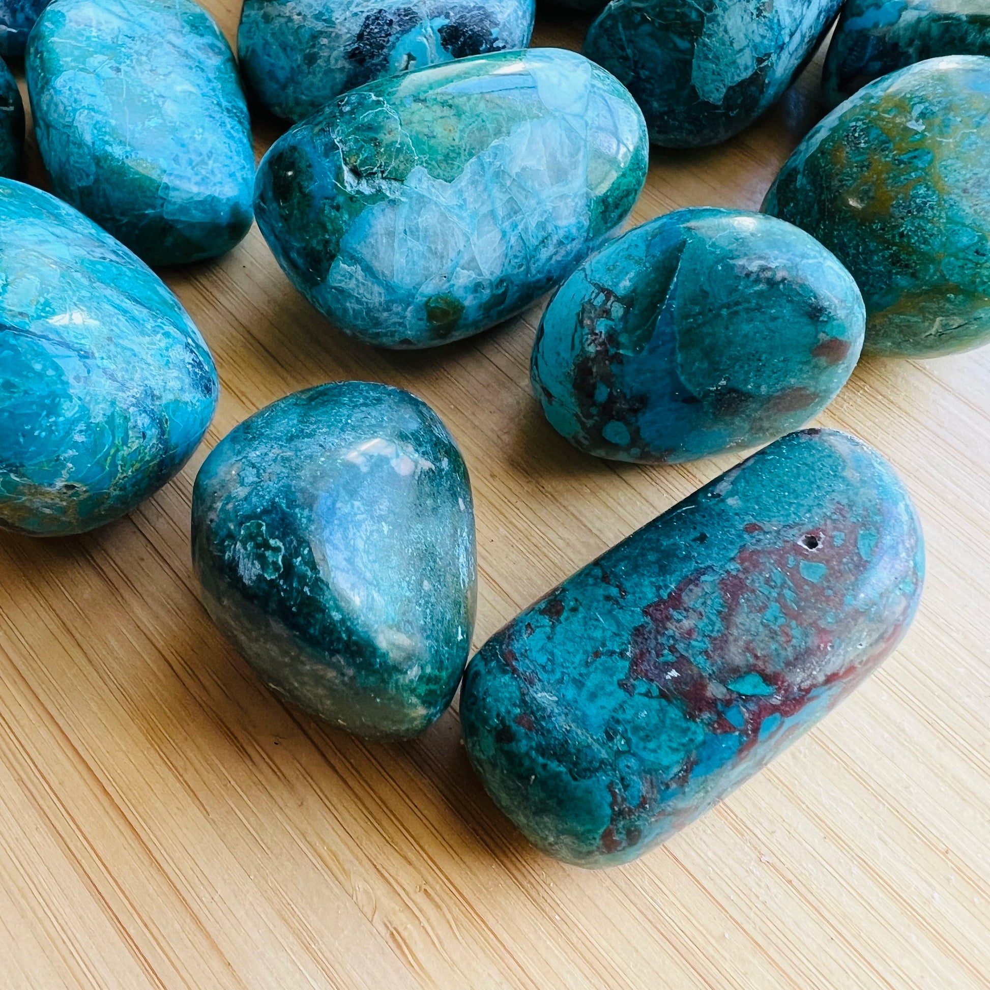 Side angle of Chrysocolla tumbled stone, Peru-sourced.