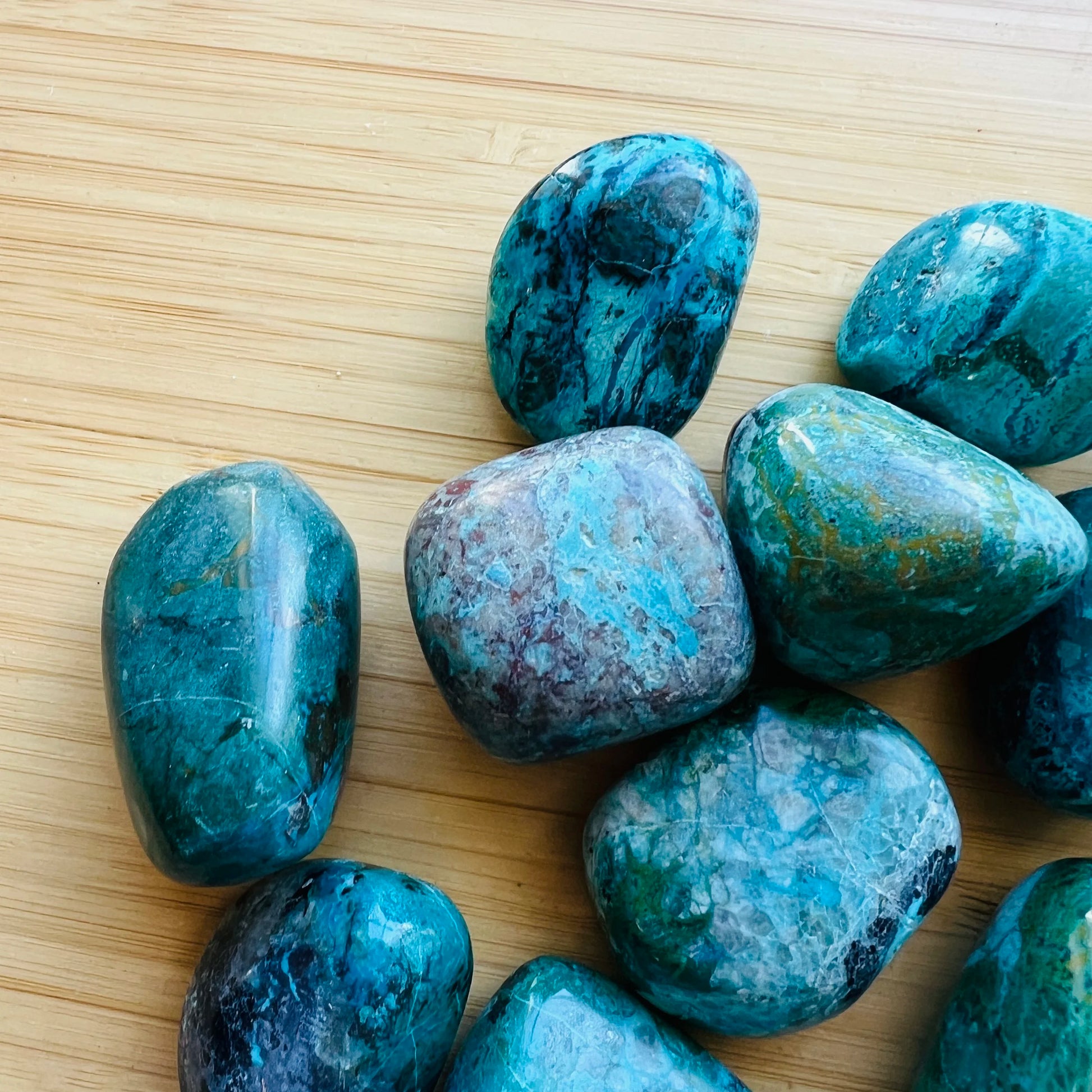 Reverse angle of Chrysocolla tumbled stone, hand-selected from Arequipa, Peru.