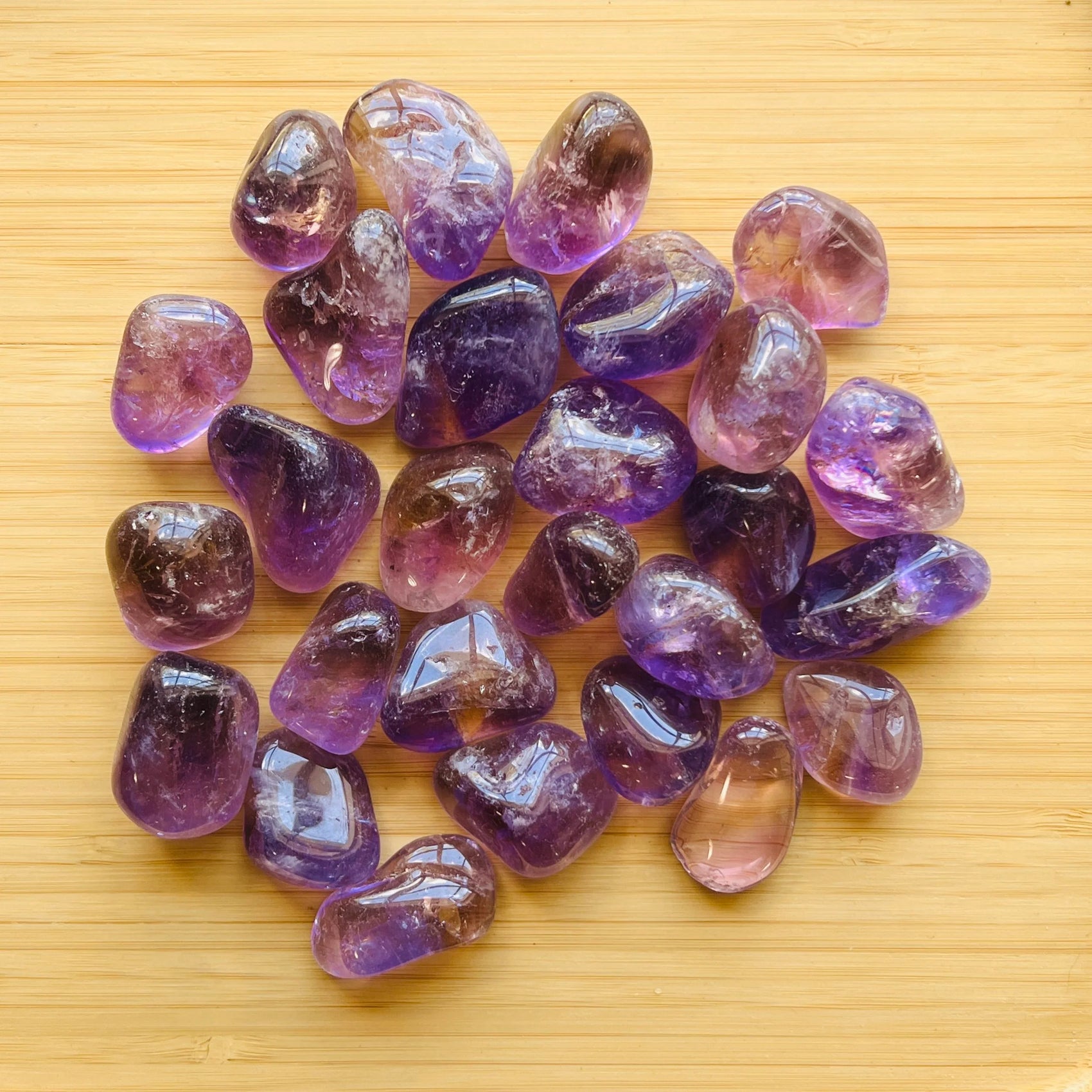 Ametrine tumbled stone in Purple, Yellow tones, ethically sourced from Bolivia for Abundance and Confidence