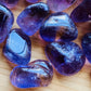 Sideways view of purple Ametrine tumbled stone, showing color depth, from Ángel Sandoval Province, Bolivia.