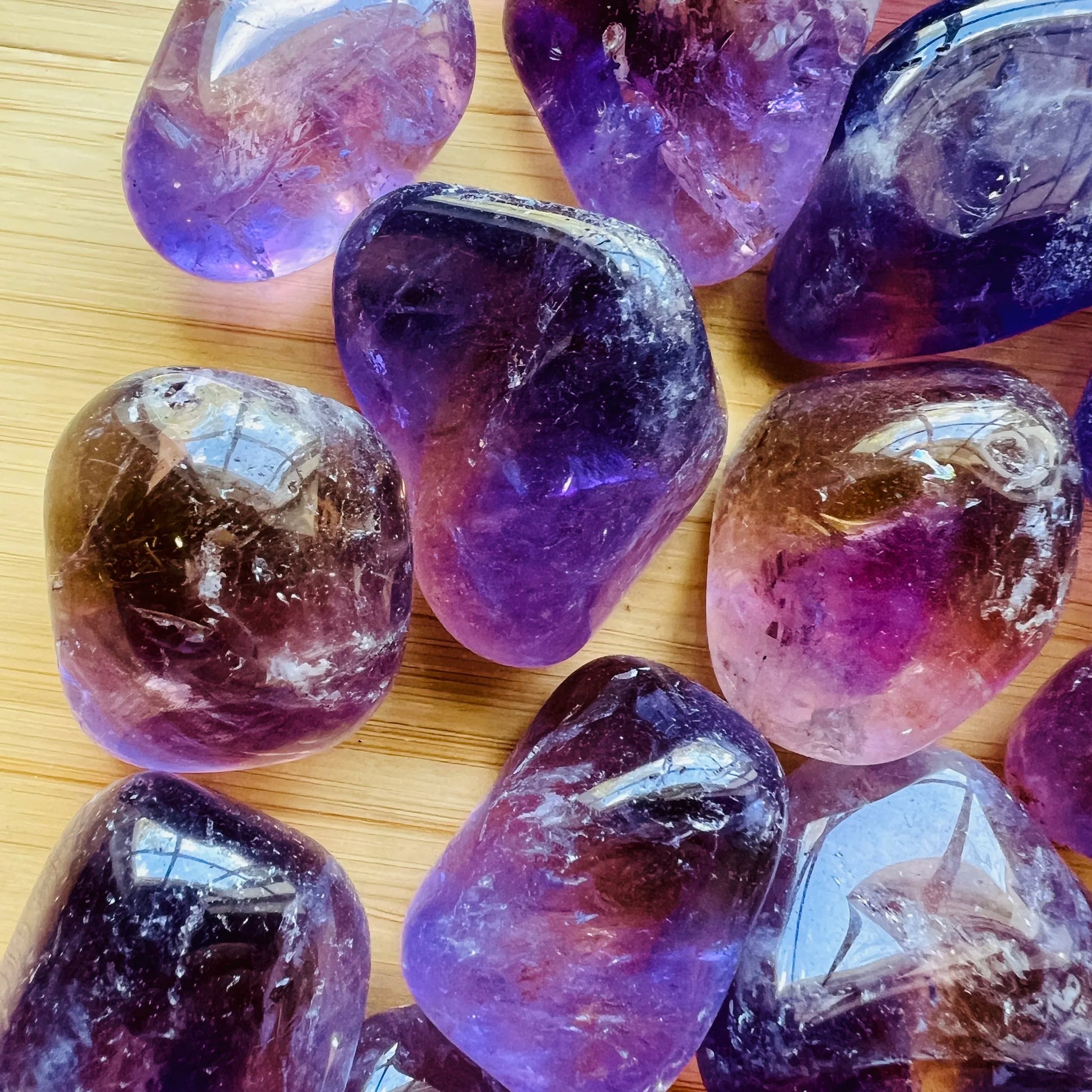Color detail of Ametrine tumbled stone, carried for Focus and Manifestation, sourced from Bolivia.