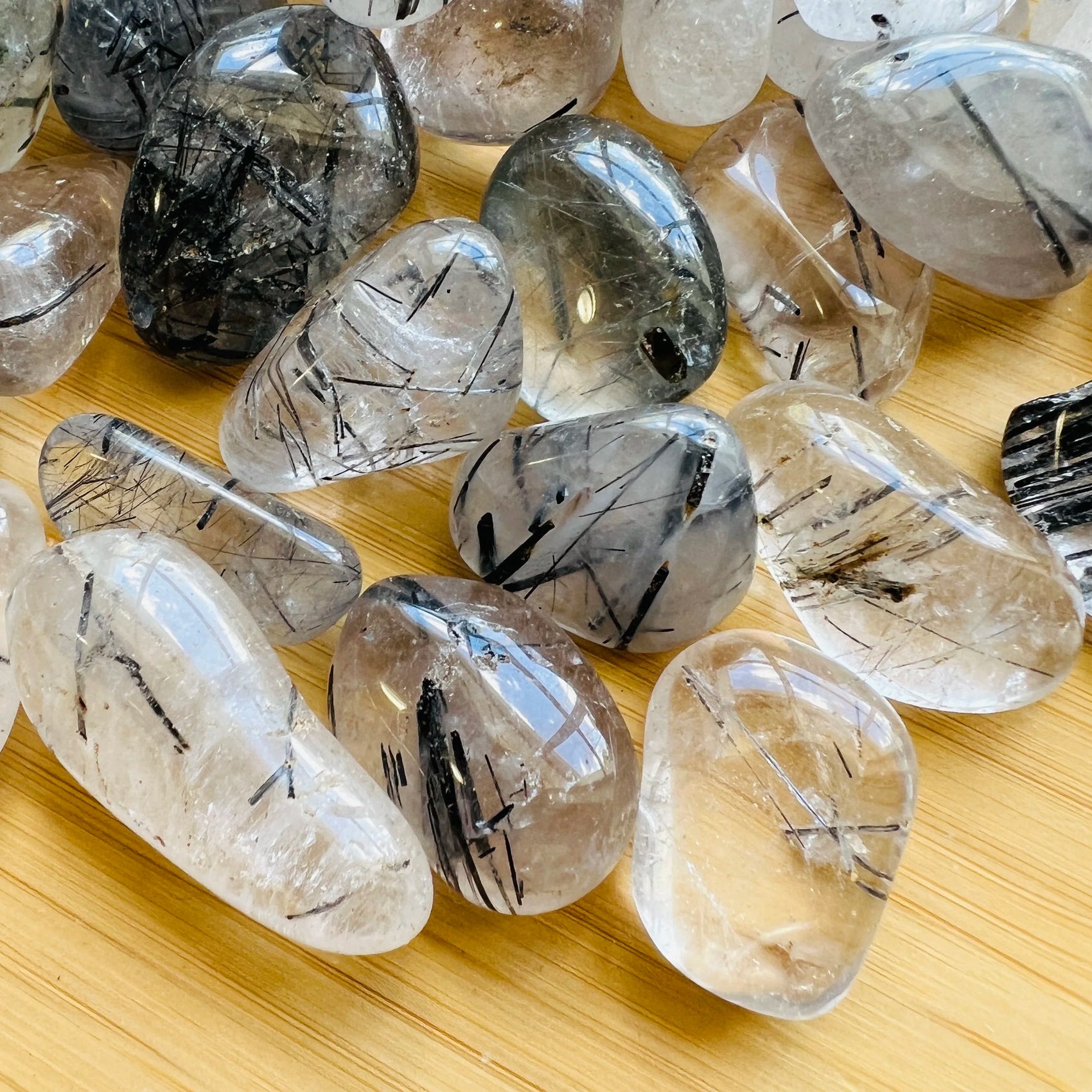 Side perspective of Quartz tumbled stone, for Cleansing and Meditation, showing soft luster.