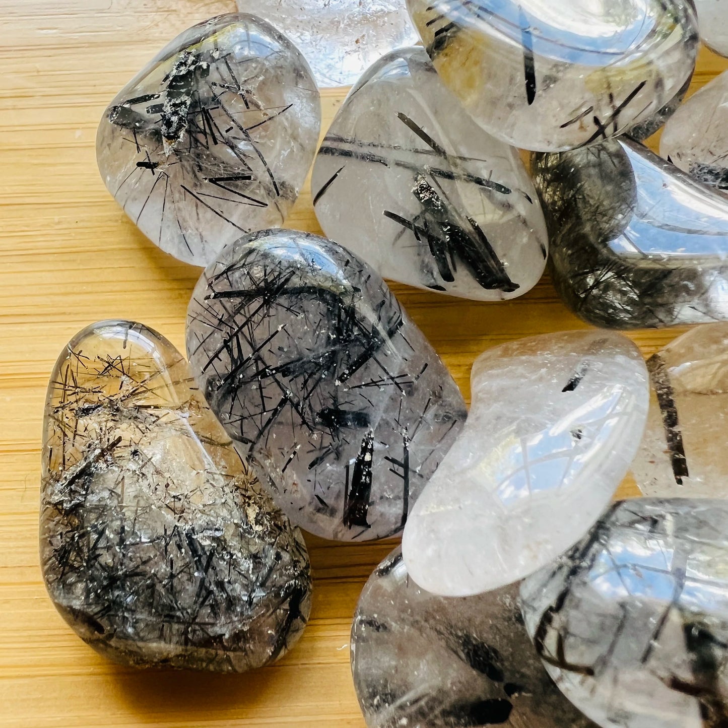 Alternate angle of Grade AAA clear Quartz tumbled stone, hand-selected from Minas Gerais, Brazil, often worked with for Cleansing.