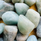 Plan view of Aquamarine tumbled stone, Brazil-sourced, kept near for Stress Relief.