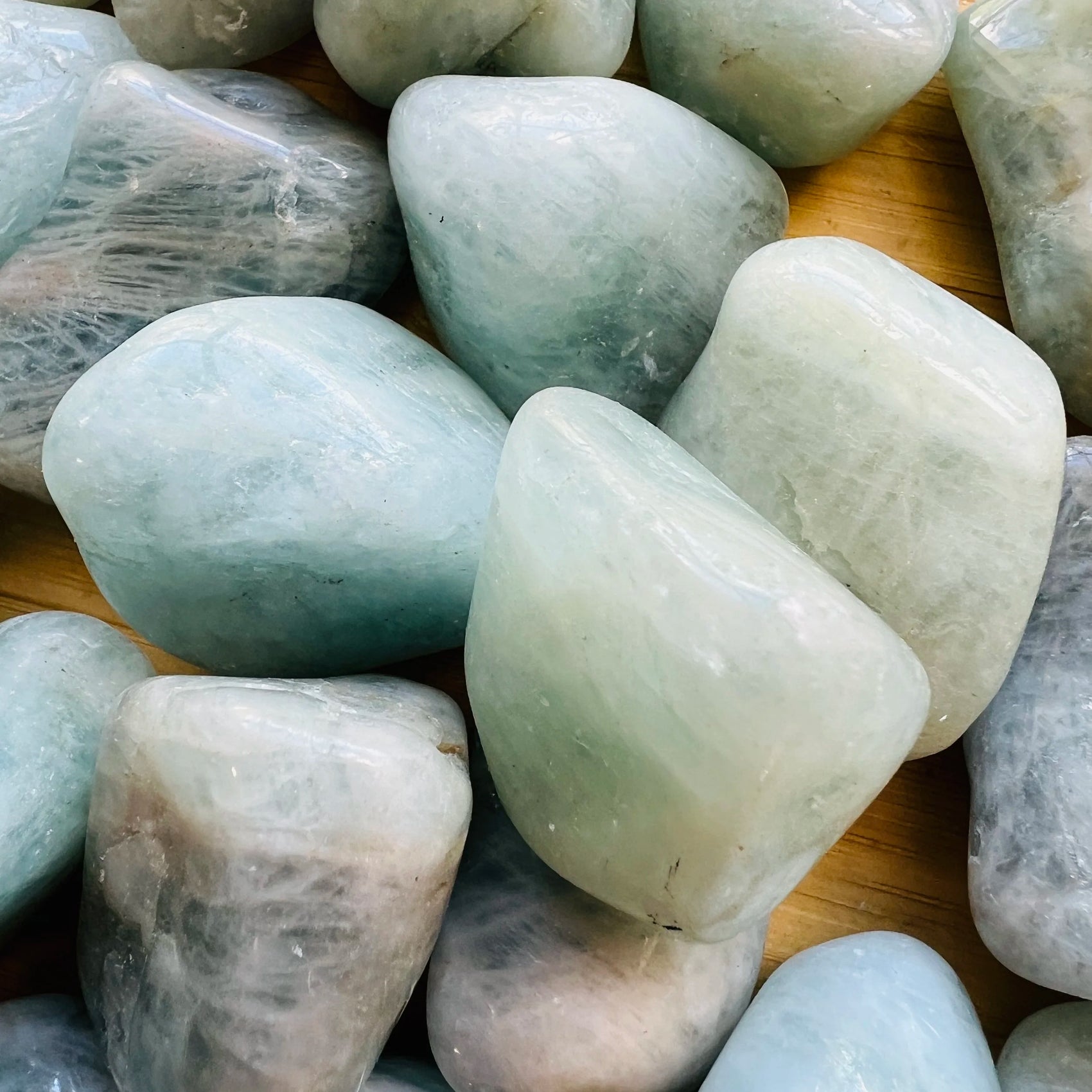 Plan view of Aquamarine tumbled stone, Brazil-sourced, kept near for Stress Relief.