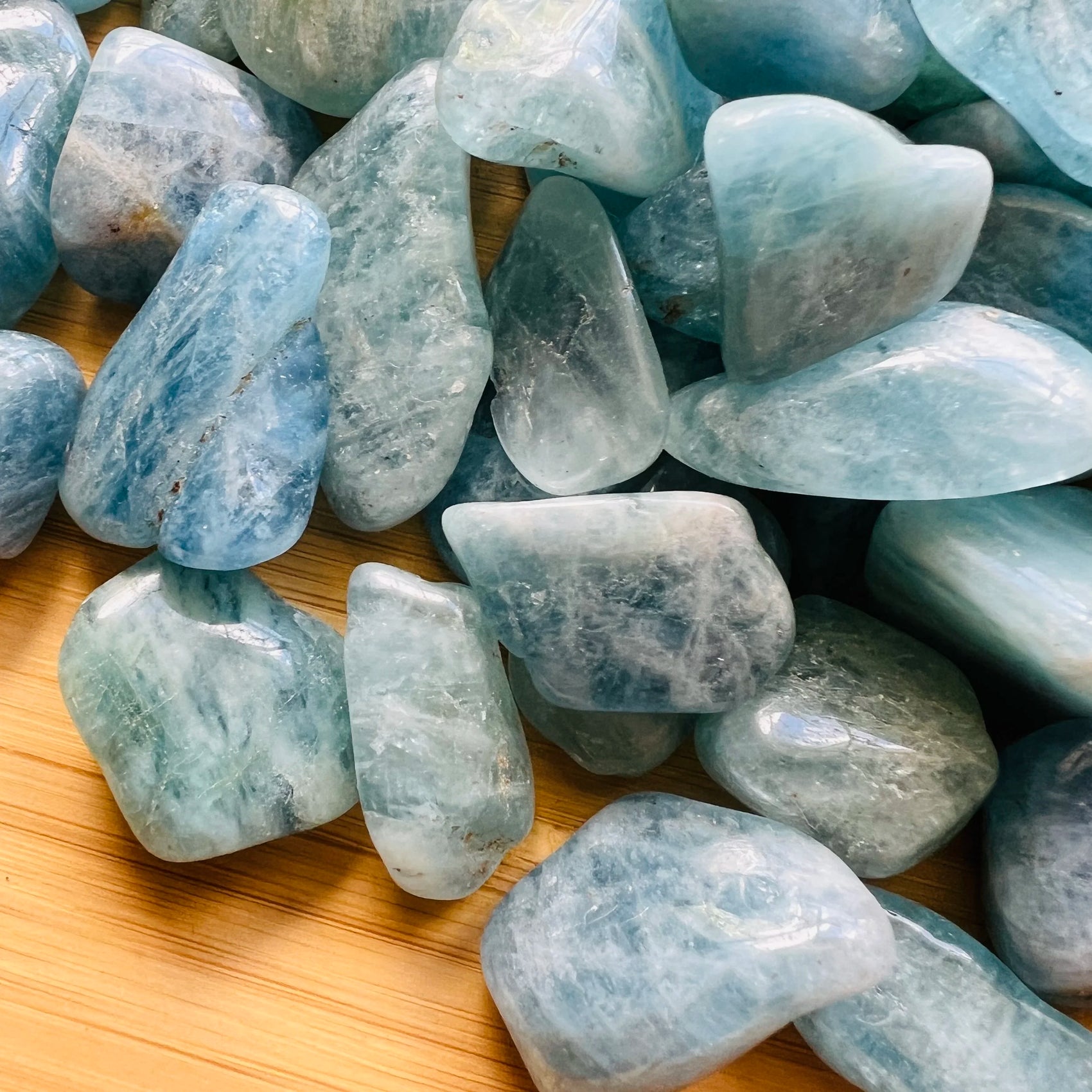Reverse side of Aquamarine tumbled stone, from Brazil.