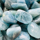 Close-up of Aquamarine tumbled stone from Brazil, soothing wellness stone for Emotional Healing
