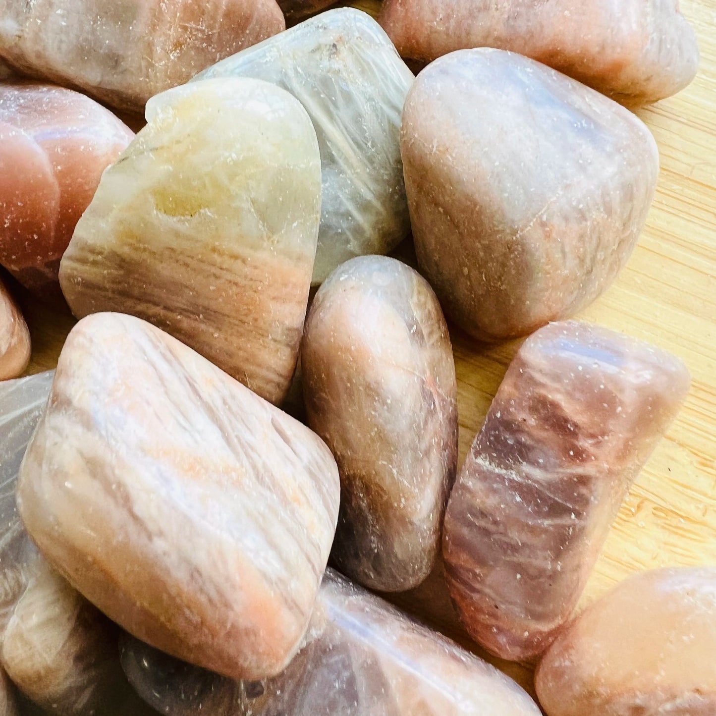 Natural light view of a Earth Moonstone tumbled stone, from Minas Gerais, Brazil.