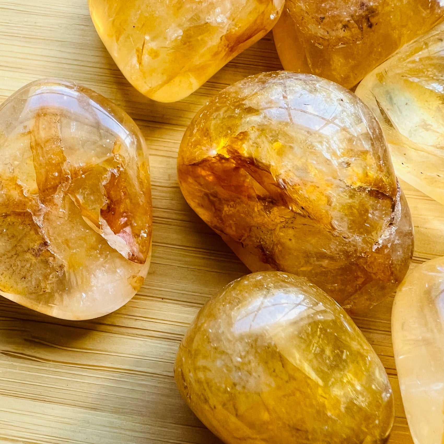 Overhead view of Golden Healer tumbled stone, hand-selected from Minas Gerais, Brazil, associated with Healing.