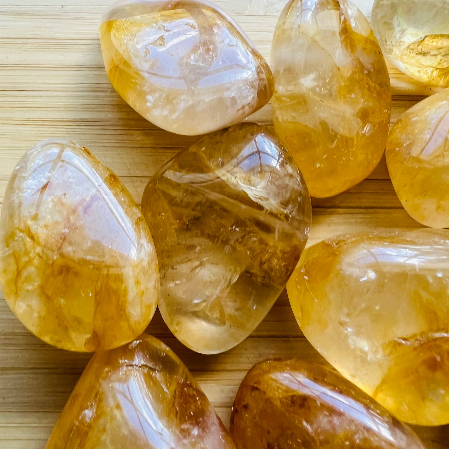 Back view of Golden Healer tumbled stone, showing color depth.